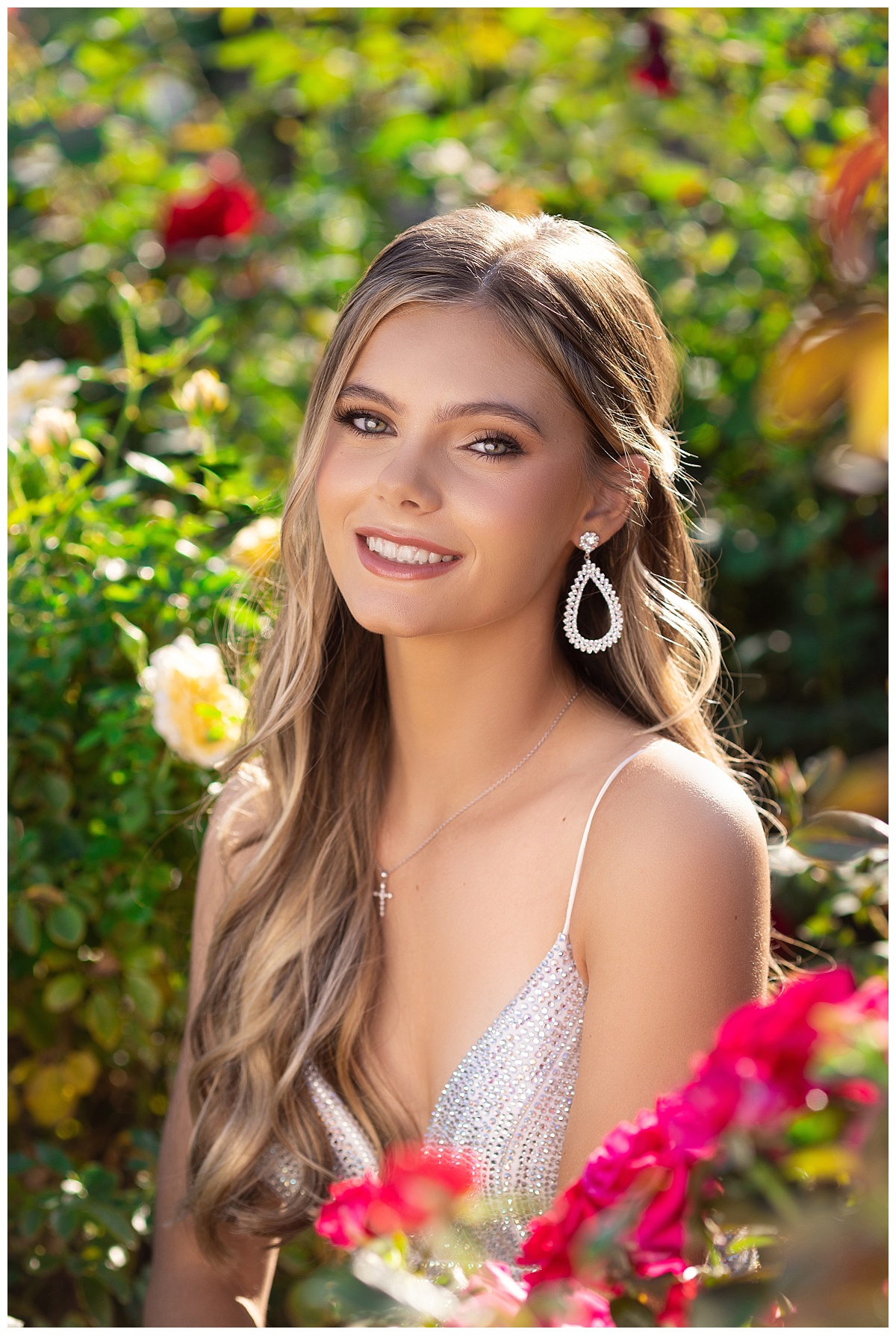 Teen girl senior portratis in roses